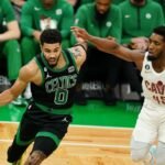 Cleveland Cavaliers and Boston Celtics players during a heated moment on the court."